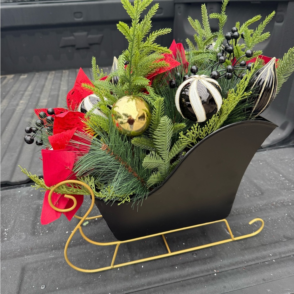 Festive Black and Gold Sleigh with Red Accents